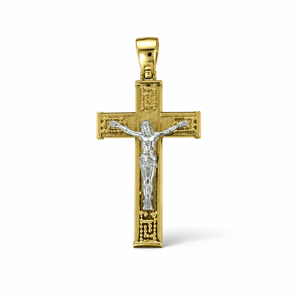 Croce bicolore in oro 18 carati con Cristo, motivi a greca e bordi lucidi, 44×22 mm, vista frontale
